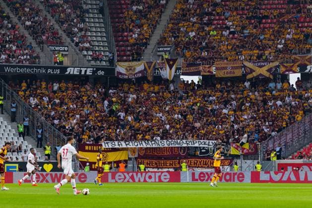 Freiburg v Motherwell, UEFA Conference League Motherwell fans hold up a sign protesting money in football and remembering the late Dolly Parton during the UEFA Conference League match between Freiburg and Motherwell at Europa Park Stadion, freiburg, Germany on 27 August 2026. Editorial use only , Copyright: xRaymondxDaviesx PSI-24751-0015