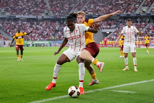 Cyriaque Irie of SC Freiburg, 22, and Ewan Wilson of Motherwell FC, 23, in a tackle; Germany, soccer, UEFA Conference League, Playoffs, 2026–2027, SC Freiburg vs. Motherwell FC, August 27, 2026, Freiburg im Breisgau, Europa-Park Stadium, Germany Copyright: xGrantxHubbsx