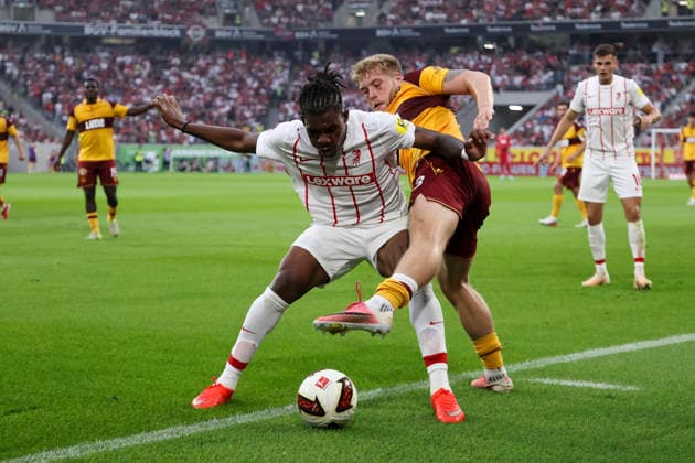 Cyriaque Irie of SC Freiburg, 22, and Ewan Wilson of Motherwell FC, 23, in a tackle; Germany, soccer, UEFA Conference League, Playoffs, 2026–2027, SC Freiburg vs. Motherwell FC, August 27, 2026, Freiburg im Breisgau, Europa-Park Stadium, Germany Copyright: xGrantxHubbsx