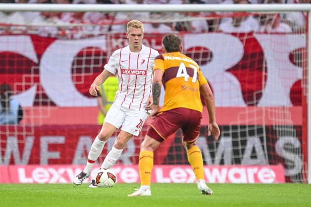 Matthias Ginter of SC Freiburg and Seb Palmer Houlden of Motherwell FC battle for the ball during the second leg of the 2026-27 UEFA Conference League Playoff Round match between Sport Club Freiburg and Motherwell at Stadion am Wolfswinkel on August 27, 2026 in Freiburg, Germany. Photo by Harry Langer, DeFodi Images