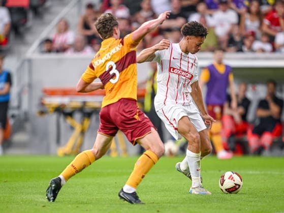 Jake Girdwood of Motherwell FC and Derry Scherhant of SC Freiburg battle for the ball during the second leg of the 2026-27 UEFA Conference League Playoff Round match between SC Freiburg and Motherwell at Stadion am Wolfswinkel on August 27, 2026 in Freiburg, Germany. Photo by Harry Langer, DeFodi Images