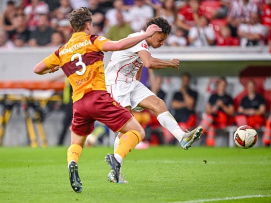 Jake Girdwood of Motherwell FC and Derry Scherhant of SC Freiburg battle for the ball during the second leg of the 2026-27 UEFA Conference League Playoff Round match between SC Freiburg and Motherwell at Stadion am Wolfswinkel on August 27, 2026 in Freiburg, Germany. Photo by Harry Langer, DeFodi Images