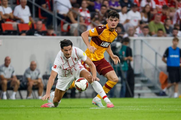 Igor Matanovic of SC Freiburg, 31, and Jamie Knight Lebel of Motherwell FC, 04, battling for the ball; Germany, soccer, UEFA Conference League, playoffs, 2026–2027, SC Freiburg vs. Motherwell FC, August 27, 2026, Freiburg im Breisgau, Europa-Park Stadium, Germany Copyright: xGrantxHubbsx