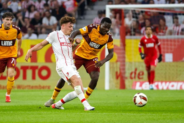Philipp Treu of SC Freiburg, 29, and Ibrahim Said of Motherwell FC, 19, battle for the ball; Germany, soccer, UEFA Conference League, playoffs, 2026–2027, SC Freiburg vs. Motherwell FC, August 27, 2026, Freiburg im Breisgau, Europa-Park Stadium, Germany Copyright: xGrantxHubbsx