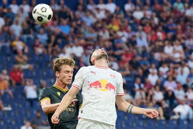 Salzburg, Austria, August 27, 2026 — UEFA Europa League 2026–2027 Playoffs, Second Leg: FC Red Bull Salzburg vs. Mjällby AIF. Pictured, from left, in a tackle: TMads Enggard (AIF) and Dominik Schmid (RB Red Bull Arena). Copyright: xFotostandx xWassmuthx