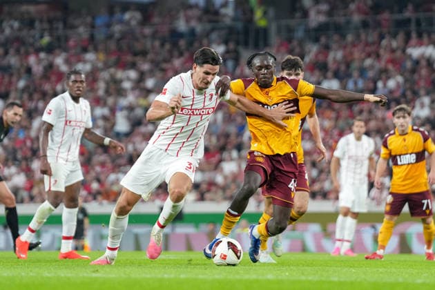Igor Matanovic (SC Freiburg), 31, in a tackle with Samuel Ngandu (Motherwell FC), 43, Germany, Soccer, UEFA Conference League, Playoffs, Second Leg, 2026–2027, SC Freiburg vs. Motherwell FC, August 27, 2026, Europa-Park Stadium, Freiburg, Freiburg, Europa-Park Stadium, Baden-Württemberg, Germany Copyright: xArnexAmbergx