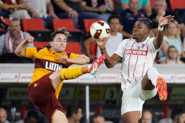 Joe Hodge of Motherwell FC, 71, and Cyriaque Irie of SC Freiburg, 22, in a tackle, Germany, soccer, UEFA Conference League, playoffs, 2026–2027, SC Freiburg vs. Motherwell FC, August 27, 2026, Freiburg im Breisgau, Europa-Park Stadium, Germany Copyright: xGrantxHubbsx