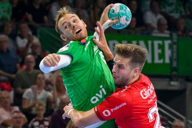 Pictured, from left: Mathias Gidsel of Füchse Berlin, 19, in a one-on-one battle, GER, Berlin, handball, Füchse Berlin vs. MT Melsungen, at the Max Schmeling Halle, August 27, 2026, Copyright: HMBxMedia UwexKoch