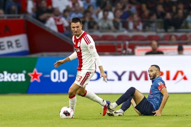 AMSTERDAM , 27-08-2026 , JohanCruijff ArenA , season 2026 2027 , UEFA Conference League play-off football . Match between Ajax and FC Sion, Picture shows Ajax player Steven Berghuis and FC Sion player Ali Kabacalman Ajax - Sion  x206095431x Copyright: