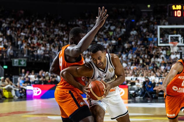 August 27, 2026, GER, FIBA 2027 Basketball World Cup, European Qualifiers, Cologne, Germany vs. Turkey, Johannes Thiemann (Germany), No. 32, in a one-on-one matchup against Nathan Kuta (Netherlands), No. 99, Cologne, LANXESS Arena, North Rhine-Westphalia, Germany