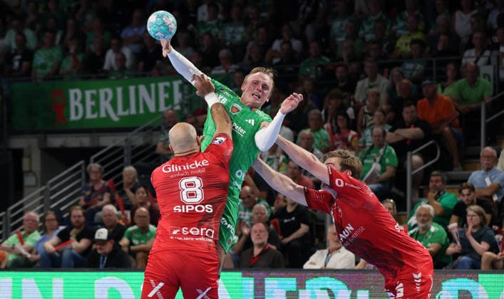 Adrian Sipos, Tobias Schjoelberg Groendahl with the ball, Reynir Thor Stefansson in a tackle; game scene; action; sports; handball; HBL Bundesliga; Men s Division 1; Matchday; 2026–2027 season; August 27, 2026; Füchse Berlin vs. MT Melsungen