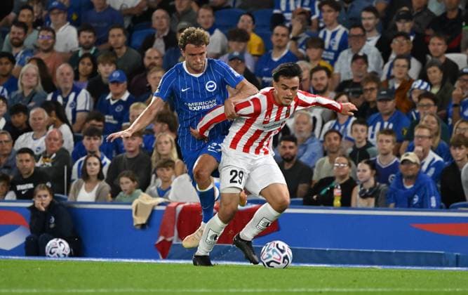 Alexander Warneryd of Tromso flies past Mats Wieffer of Brighton during the Europa Conference League Qualifying match between Brighton and Hove Albion and Tromso at the American Express Stadium, Brighton UK - Thursday 27th August 2026 Brighton v Tromso Europa Conference League 2026, Amex Stadium, Sussex, UK - 27 Aug 2026Brighton Amex Stadium Sussex United Kingdom Editorial use only. No merchandising. For Football images FA and Premier League restrictions apply inc. no internet mobile usage without FAPL license - for details contact Football Dataco  Copyright: xLizxFinlayson TPI Shutterstockx 17121964bd