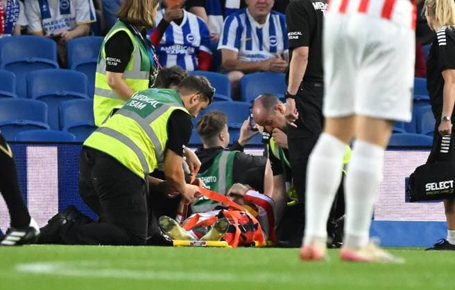 Vetie Skjoervik of Tromso gets treatment before going off injured on a stretcher during the Europa Conference League Qualifying match between Brighton and Hove Albion and Tromso at the American Express Stadium, Brighton UK - Thursday 27th August 2026 Brighton v Tromso Europa Conference League 2026, Amex Stadium, Sussex, UK - 27 Aug 2026Brighton Amex Stadium Sussex United Kingdom Editorial use only. No merchandising. For Football images FA and Premier League restrictions apply inc. no internet mobile usage without FAPL license - for details contact Football Dataco  Copyright: xLizxFinlayson TPI Shutterstockx 17121964au