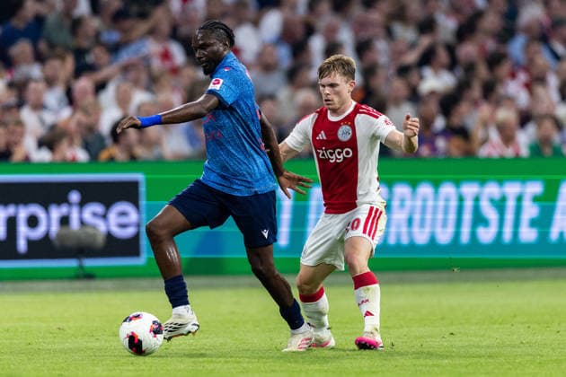 2026-08-27 UEFA Conference League: AFC Ajax v FC Sion AMSTERDAM, NETHERLANDS - AUGUST 27: Josias Lukembila of FC Sion and Oliver Edvardsen of AFC Ajax during the UEFA Conference League match between AFC Ajax and FC Sion at Johan Cruijff Arena on August 27, 2026 in Amsterdam, Netherlands. Amsterdam Johan Cruijff Arena Netherlands Content not available for redistribution in The Netherlands directly or indirectly through any third parties. Copyright: xMarcelxvanxPlateringenx