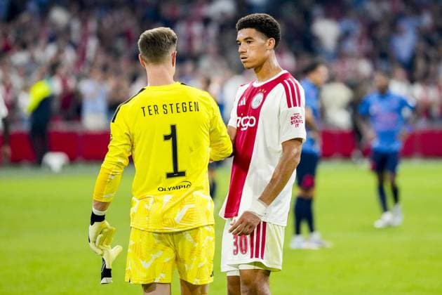 AMSTERDAM , 27-08-2026 , JohanCruijff ArenA , season 2026 2027 , UEFA Conference League play-off football . Match between Ajax and FC Sion, Picture shows Ajax goalkeeper Marc-Andre ter Stegen and Ajax player Aaron Bouwman Ajax - Sion  x206098189x Copyright: