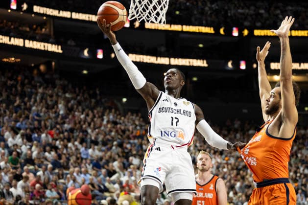 Dennis SCHROEDER SCHRÖDER GER, 17, left, with the ball, shooting toward the basket, in a one-on-one matchup against Troy KOEHLER NED, 16, right, action, international basketball game, World Cup qualifier, Germany GER vs. Netherlands NED, final score 99–83, FIBA Basketball World Cup European Qualifiers, 2nd Round, Group K, on August 27, 2026, at the Lanxess Arena in Cologne