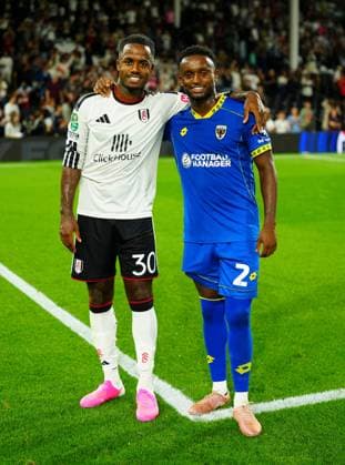 Ryan Sessegnon of Fulham and Steven Sessegnon of AFC Wimbledon pose together at full time Fulham v AFC Wimbledon, EFL Carabao Cup, Second Round, Football, Craven Cottage, London, UK - 27 Aug 2026London Craven Cottage United Kingdom EDITORIAL USE ONLY No use with unauthorised audio, video, data, fixture lists, club league logos or live services. Online in-match use limited to 120 images, no video emulation. No use in betting, games or single club league player publications.  Copyright: xJavierxGarcia Shutterstockx 17118946bb