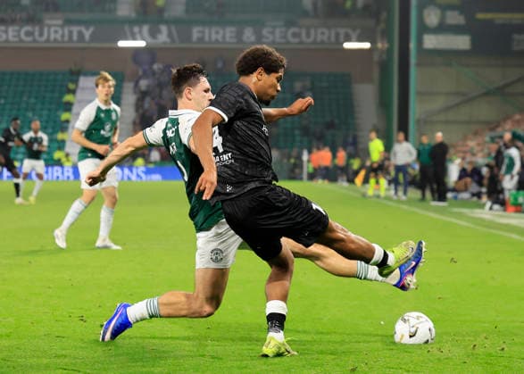 Hibernian v K.A.A. Gent UEFA Europa Conference League Kyrell Wilson of K.A.A. Gent clears under pressure from Adam Mayor of Hibernian during the UEFA Europa Conference League Play-Off Second Leg match at Easter Road, Edinburgh 27 08 2026 UK Newspapers OUT Copyright: xFredxPalmerx FIL-23844-0116