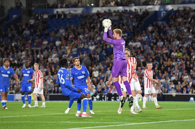 Brighton and Hove Albion v Tromso, UEFA Conference League Jakob Haugaard Goalkeeper of Tromso IL collects the ball under pressure from the incoming Zadok Yohanna Forward of Brighton and Hove Albion and Yasin Ayari Midfielder of Brighton and Hove Albion during the UEFA Conference League match between Brighton and Hove Albion and Tromso at the American Express Stadium, Brighton and Hove, UK on 27 August 2026. Brighton and Hove American Express Stadium East Sussex UK Editorial use only , Copyright: xJeffxMoodx PSI-24752-0076