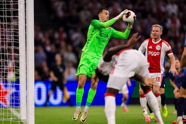 AMSTERDAM, NETHERLANDS - AUGUST 27: FC Sion goalkeeper Anthony Racioppi makes a save during the UEFA Conference League 2026 27 Play Off Round Second Leg match between AFC Ajax and FC Sion at the Johan Cruijff ArenA on August 27, 2026 in Amsterdam, Netherlands.  Copyright: xRenexNijhuis MBxMediax