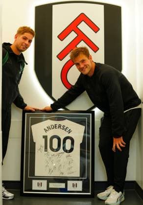 Emile Smith Rowe of Fulham photobombs Joachim Andersen as he poses with a signed and framed shirt to mark his 100th appearance for the club Fulham v AFC Wimbledon, EFL Carabao Cup, Second Round, Football, Craven Cottage, London, UK - 27 Aug 2026London Craven Cottage United Kingdom EDITORIAL USE ONLY No use with unauthorised audio, video, data, fixture lists, club league logos or live services. Online in-match use limited to 120 images, no video emulation. No use in betting, games or single club league player publications.  Copyright: xJavierxGarcia Shutterstockx 17118946cv
