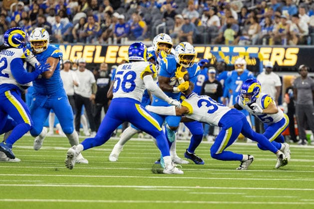 INGLEWOOD, CA - AUGUST 27: Amar Johnson 35 of the Los Angeles Chargers carries the ball while tackled by Alex Cook 39 of the Los Angeles Rams during an NFL, American Football Herren, USA preseason game between the Los Angeles Rams and the Los Angeles Chargers on August 27, 2026, at SoFi Stadium in Inglewood, California. (Photo by Greg Fiore Icon Sportswire) NFL: AUG 27 Rams at Chargers EDITORIAL USE ONLY Icon2608271591