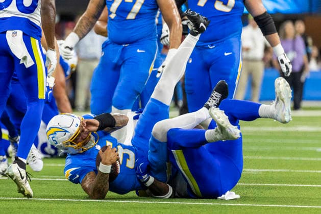 August 27, 2026, Inglewood, California, USA: Los Angeles Chargers Outside Linebacker Trey Lance (5) is brought down by Los Angeles Rams Defensive End Braden Fiske (55) during an NFL, American Football Herren, USA football preseason game, in Inglewood, Calif. on Thursday August 27, 2026. NHL, Eishockey Herren, USA 2026: LA Chargers Vs LA Rams  - ZUMAc68_ 20260827_zaf_c68_003 Copyright: xRingoxChiux