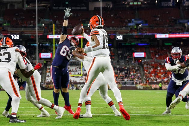 CLEVELAND, OH - AUGUST 27: Cleveland Browns quarterback Taylen Green (15) holds on to the football as New England Patriots defensive tackle Casey Rogers (65) applies pressure during the third quarter of the National Football League preseason game between the New England Patriots and Cleveland Browns on August 27, 2026, at Huntington Bank Field in Cleveland, OH. (Photo by Frank Jansky Icon Sportswire) NFL, American Football Herren, USA AUG 27 Patriots at Browns EDITORIAL USE ONLY Icon260827044