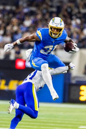 August 27, 2026, Inglewood, California, USA: Los Angeles Chargers Running Back Gregory Desrosiers (31) leaps over Los Angeles Rams Cornerback Cam Lampkin (21) during an NFL, American Football Herren, USA football preseason game, in Inglewood, Calif. on Thursday August 27, 2026. Inglewood USA - ZUMAc68_ 20260827_zaf_c68_011 Copyright: xRingoxChiux