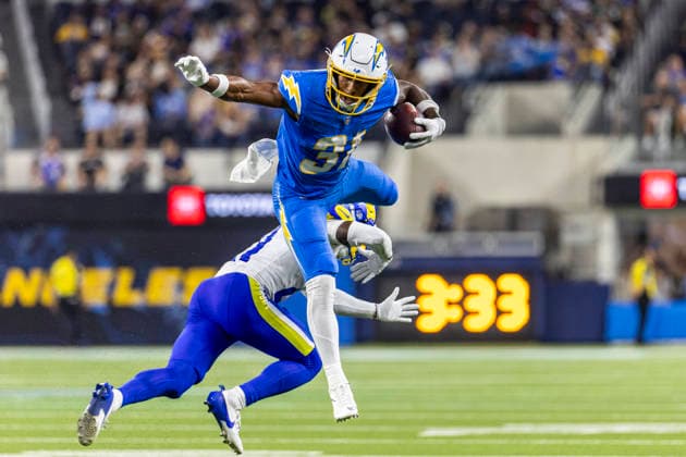 August 27, 2026, Inglewood, California, USA: Los Angeles Chargers Running Back Gregory Desrosiers (31) leaps over Los Angeles Rams Cornerback Cam Lampkin (21) during an NFL, American Football Herren, USA football preseason game, in Inglewood, Calif. on Thursday August 27, 2026. Inglewood USA - ZUMAc68_ 20260827_zaf_c68_012 Copyright: xRingoxChiux