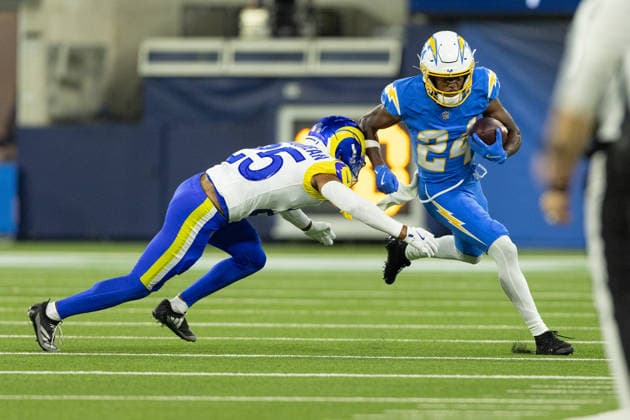 INGLEWOOD, CA - AUGUST 27: Devonte Ross 24 of the Los Angeles Chargers carries the ball while Nyzier Fourqurean 25 of the Los Angeles Rams attempts to tackle during an NFL, American Football Herren, USA preseason game between the Los Angeles Rams and the Los Angeles Chargers on August 27, 2026, at SoFi Stadium in Inglewood, California. (Photo by Greg Fiore Icon Sportswire) NFL: AUG 27 Rams at Chargers EDITORIAL USE ONLY Icon2608271923