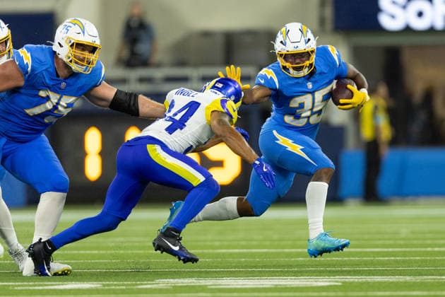 INGLEWOOD, CA - AUGUST 27: Amar Johnson 35 of the Los Angeles Chargers carries the ball while Tanner Ingle 34 of the Los Angeles Rams closes in during an NFL, American Football Herren, USA preseason game between the Los Angeles Rams and the Los Angeles Chargers on August 27, 2026, at SoFi Stadium in Inglewood, California. (Photo by Greg Fiore Icon Sportswire) NFL: AUG 27 Rams at Chargers EDITORIAL USE ONLY Icon2608271957