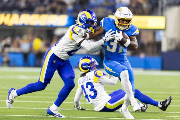 August 27, 2026, Inglewood, California, USA: Los Angeles Chargers Running Back Gregory Desrosiers (31) escapes a tackle-attempt by Los Angeles Rams Cornerback Cam Lampkin (21) during an NFL, American Football Herren, USA football preseason game, in Inglewood, Calif. on Thursday August 27, 2026. Inglewood USA - ZUMAc68_ 20260827_zaf_c68_015 Copyright: xRingoxChiux