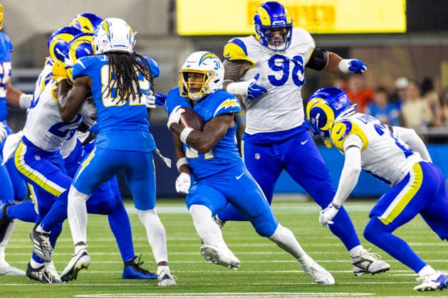 August 27, 2026, Inglewood, California, USA: Los Angeles Chargers Running Back Gregory Desrosiers (31) runs the ball fighting off pressure from Los Angeles Rams during an NFL, American Football Herren, USA football preseason game, in Inglewood, Calif. on Thursday August 27, 2026. NHL, Eishockey Herren, USA 2026: LA Rams 20:18 LA Chargers  - ZUMAc68_ 20260827_zaf_c68_044 Copyright: xRingoxChiux