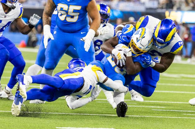 August 27, 2026, Inglewood, California, USA: Los Angeles Chargers Running Back Kimani Vidal (28) is brought down by Los Angeles Rams Cornerback Cam Lampkin (21) and Offensive Lineman Beaux Limmer (50) during an NFL, American Football Herren, USA football preseason game, in Inglewood, Calif. on Thursday August 27, 2026. Inglewood USA - ZUMAc68_ 20260827_zaf_c68_041 Copyright: xRingoxChiux