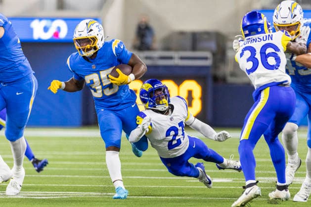 August 27, 2026, Inglewood, California, USA: Los Angeles Chargers Running Back Amar Johnson (35) escapes a tackle-attempt by Los Angeles Rams Cornerback Cam Lampkin (21) during an NFL, American Football Herren, USA football preseason game, in Inglewood, Calif. on Thursday August 27, 2026. Inglewood USA - ZUMAc68_ 20260827_zaf_c68_050 Copyright: xRingoxChiux