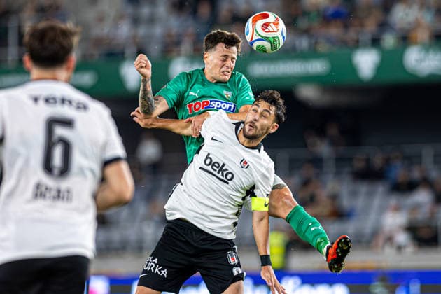 UEFA Europa League play-offs, 2nd leg – Kauno Žalgiris vs Besiktas at Dariaus ir Gireno Stadium, Kaunas, Lithuania. Franco Baldassarra challenges Kartal Kayra Yilmaz during the UEFA Europa League play-offs second leg match between Kauno Zalgiris and Besiktas at Dariaus ir Gireno Stadium in Kaunas, Lithuania. Kaunas Kaunas Lithuania