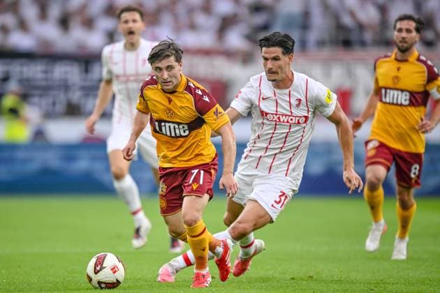 Joe Hodge of Motherwell FC and Igor Matanovic SC Freiburg battles for the ball during the second leg of the 2026–27 UEFA Conference League Playoff Round match between Sport Club Freiburg and Motherwell at Stadion am Wolfswinkel on August 27, 2026, in Freiburg, Germany. Photo by Harry Langer, DeFodi Images