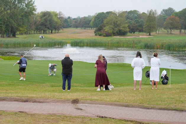 SUTTON COLDFIELD, ENGLAND - AUG 28: Spectators in their dressing gowns watch the early play during the completion of the delayed Round 1 at the 2026 Husqvarna British Masters at The Belfry, Sutton Coalfield on August 28, 2026 in Warwickshire, England The 2026 Husqvarna British Masters