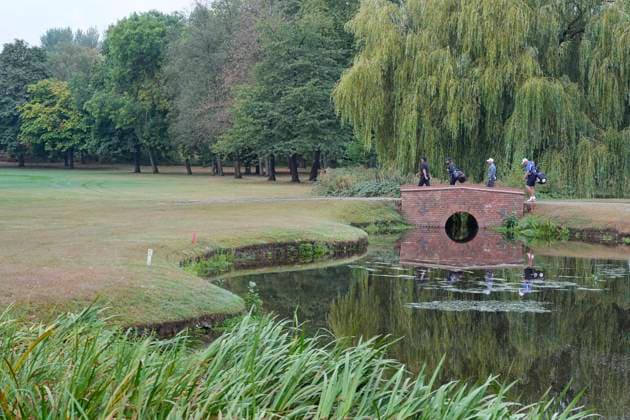 SUTTON COLDFIELD, ENGLAND - AUG 28: Patrick Reed (USA) and Paul Waring (ENG) cross the bridge on the 9th hole during the completion of the delayed Round 1 at the 2026 Husqvarna British Masters at The Belfry, Sutton Coalfield on August 28, 2026 in Warwickshire, England The 2026 Husqvarna British Masters