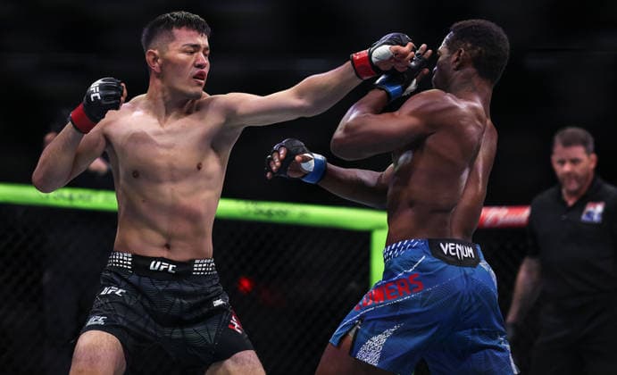 (260828) -- SHANGHAI, Aug. 28, 2026 -- Maheshate (L) of China competes against Darrius Flowers of the United States during the Road to UFC Lightweight Bout 3 Rounds at the Oriental Sports Center in east China s Shanghai, Aug. 28, 2026. ) (SP)CHINA-SHANGHAI-ROAD TO UFC (CN) LixMing 