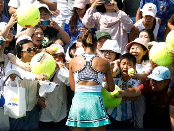 Qinwen Zheng of China signs autographs after match point defeating Elena Pridankina in straight sets in their qualifying final at the 2026 US Open Tennis Championship at the USTA Billie Jean King National Tennis Center in New York City on Friday, August 28, 2026.  NYP20260828127 JOHNxANGELILLO