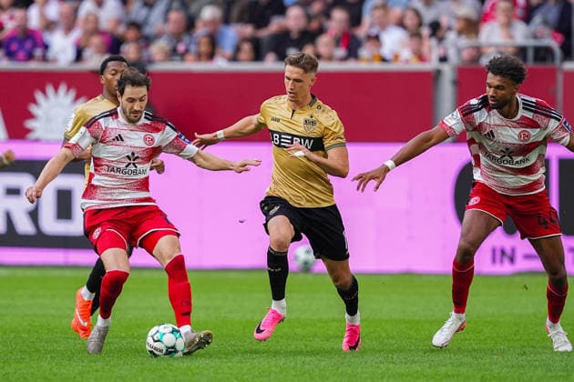 August 28, 2026, xydrx, Soccer, 3. Liga, Fortuna Düsseldorf vs. VfB Stuttgart II, 2026–2027 season, Merkur Spiel Arena: Oliver Roelke (VfB Stuttgart II), No. 11, in a tackle against Marcel Benger (Fortuna Düsseldorf), No. 16, and Elias Egouli (Fortuna Düsseldorf), No. 44. DFB regulations prohibit any use of photographs as image sequences and or quasi-video. Copyright: HMBxMedia YannisxDreimann