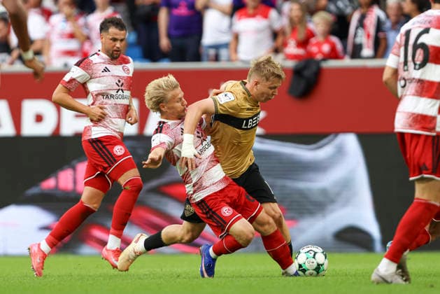 Andreas Mueller of Fortuna Düsseldorf and Julian Lueers of VfB Stuttgart II battle for the ball during the 3. Liga match between Fortuna Düsseldorf and VfB Stuttgart II at the Merkur Spiel Arena on August 28, 2026, in Düsseldorf, Germany. Photo by Oliver Kaelke, DeFodi Images. Andreas Mueller of Fortuna Düsseldorf and Julian Lueers of VfB Stuttgart II battle for the ball during the 3. Liga match between Fortuna Düsseldorf and VfB Stuttgart II at the Merkur Spiel Arena on August 28, 2026 in Düsseldorf, Germany. Photo by Oliver Kaelke, DeFodi Images. DFB and DFL regulations prohibit any use of photographs as image sequences and or quasi-video. Photo by Oliver Kaelke, DeFodi Images.