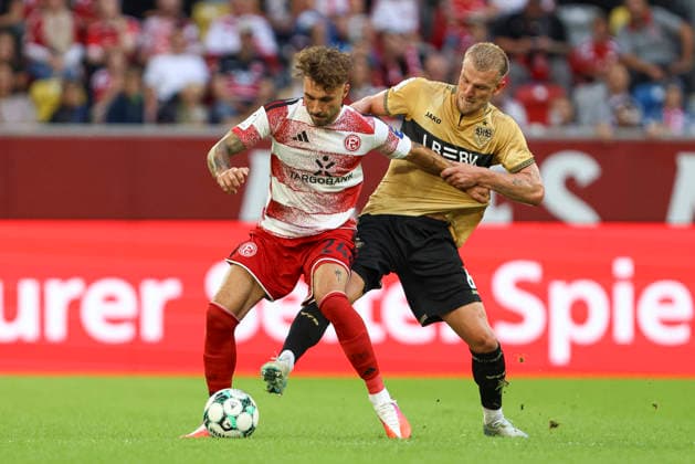 Fabian Schleusener of Fortuna Düsseldorf and Alexander Groiss of VfB Stuttgart II battle for the ball during the 3. Liga match between Fortuna Düsseldorf and VfB Stuttgart II at the Merkur Spiel Arena on August 28, 2026, in Düsseldorf, Germany. Photo by Oliver Kaelke, DeFodi Images. Fabian Schleusener of Fortuna Düsseldorf and Alexander Groiss of VfB Stuttgart II battle for the ball during the 3. Liga match between Fortuna Düsseldorf and VfB Stuttgart II at Merkur Spiel Arena on August 28, 2026 in Düsseldorf, Germany. Photo by Oliver Kaelke, DeFodi Images. DFB and DFL regulations prohibit any use of photographs as image sequences and or quasi-video. Photo by Oliver Kaelke, DeFodi Images.
