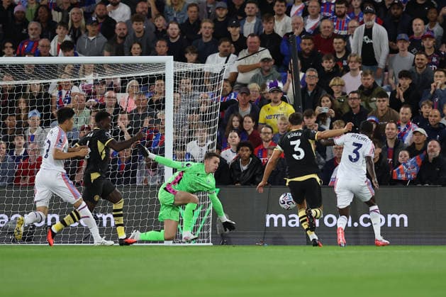 28th August 2026; Selhurst Park, Selhurst, London, England; Premier League Football, Crystal Palace versus Manchester City; goalkeeper Dean Henderson of Crystal Palace blocks a close range rebound attempt on goal by Ruben Dias of Manchester City KatiexChan