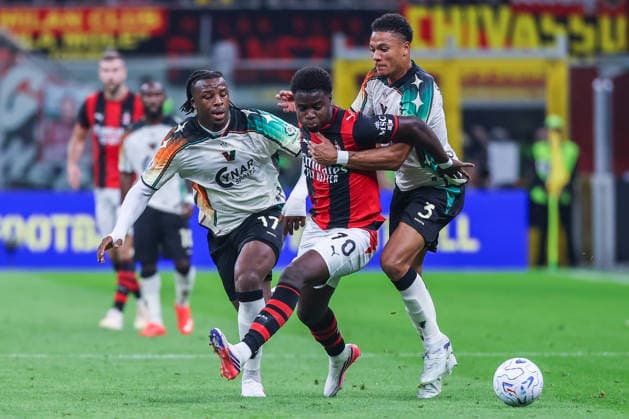 Alphadjo Cisse of AC Milan competes for the ball with Joel Marcel Schingtienne of Venezia FC during Serie A 2026 27 football match between AC Milan and Venezia FC Italy Copyright: xBEAUTIFULxSPORTS Carabellix