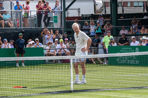 NEWPORT, RI - AUGUST 28: American former tennis player John McEnroe reacts while playing tennis during the International Tennis Hall of Fame Celebrity Pro Classic on August 28, 2026 at the International Tennis Hall of Fame in Newport, RI. (Photo by Erica Denhoff Icon Sportswire) TENNIS: AUG 28 International Tennis Hall of Fame Celebrity Pro Classic EDITORIAL USE ONLY Icon26082813