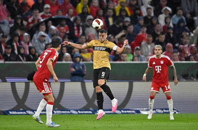 Ermedin Demirovic VfB Stuttgart (09) Aktion Min-jae Kim FC Bayern Muenchen FCB (03) Luis Diaz FC Bayern Muenchen FCB (14) FC Bayern Muenchen FCB vs VfB Stuttgart 28.08.2026 DFL REGULATIONS PROHIBIT ANY USE OF PHOTOGRAPHS AS IMAGE SEQUENCES AND OR QUASI-VIDEO FC Bayern Muenchen FCB vs VfB Stuttgart *** Ermedin Demirovic, VfB Stuttgart 09; Min Jae Kim, FC Bayern Munich (FCB) 03; Luis Diaz, FC Bayern Munich (FCB) 14; FC Bayern Munich (FCB) vs. VfB Stuttgart, August 28, 2026. DFL regulations prohibit any use of PHOTOGRAPHS AS IMAGE SEQUENCES AND OR QUASI-VIDEO FC Bayern Munich FCB vs. VfB Stuttgart