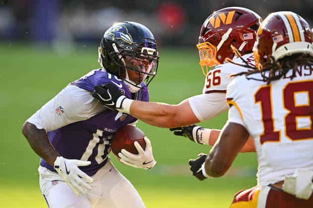 Baltimore Ravens wide receiver Lajohntay Wester (10) runs past Washington Commanders linebacker Kain Medrano (56) and safety Tyler Owens (18) for a first down during the first quarter of a preseason game at M&T Bank Stadium in Baltimore, Maryland, on Friday, August 28, 2026.  BAL20260828104 DAVIDxTULIS